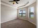 Spacious bedroom with carpeting, neutral walls, and water views at 8199 Varenna Dr, Sarasota, FL 34231