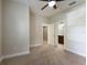 Bedroom with carpet, neutral walls, and access to a bathroom at 8199 Varenna Dr, Sarasota, FL 34231