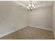 Simple dining room with tile floors and chandelier at 8199 Varenna Dr, Sarasota, FL 34231