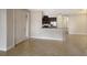 Bright entryway with tile floors and kitchen view at 8199 Varenna Dr, Sarasota, FL 34231