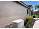 Home exterior showcasing a generator and landscaped walkway at 8199 Varenna Dr, Sarasota, FL 34231