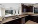 Kitchen features granite counters and stainless steel appliances at 8199 Varenna Dr, Sarasota, FL 34231
