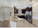 Modern kitchen with dark cabinets and granite counters at 8199 Varenna Dr, Sarasota, FL 34231