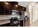 Stainless steel appliances and granite countertops in this kitchen at 8199 Varenna Dr, Sarasota, FL 34231