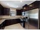 Modern kitchen with stainless steel appliances and granite countertops at 8199 Varenna Dr, Sarasota, FL 34231