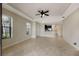 Spacious living room with tile floors and ceiling fan at 8199 Varenna Dr, Sarasota, FL 34231