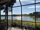 Spacious screened patio with serene lake view at 8199 Varenna Dr, Sarasota, FL 34231