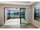 Bright screened patio with water view and brick pavers at 8199 Varenna Dr, Sarasota, FL 34231