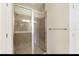 Large walk-in shower with tiled walls and a built-in seat at 8199 Varenna Dr, Sarasota, FL 34231