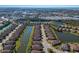 Aerial view of a large community with waterfront property and various amenities at 8224 Varenna Dr, Sarasota, FL 34231