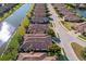 Aerial view showing homes and a canal in a residential community at 8224 Varenna Dr, Sarasota, FL 34231