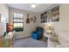 Cozy bedroom with a comfortable armchair and large window at 8224 Varenna Dr, Sarasota, FL 34231