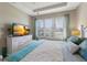 Bright bedroom with a comfy bed and plenty of natural light at 8224 Varenna Dr, Sarasota, FL 34231