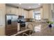 Modern kitchen with stainless steel appliances and granite countertops at 8224 Varenna Dr, Sarasota, FL 34231