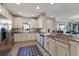 Spacious kitchen featuring granite countertops, stainless steel appliances, and white cabinets at 8224 Varenna Dr, Sarasota, FL 34231