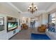 Living room with a view into the kitchen and access to the backyard at 8224 Varenna Dr, Sarasota, FL 34231