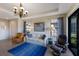 Living area with comfortable seating and a chandelier at 8224 Varenna Dr, Sarasota, FL 34231