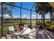 Spacious screened porch with lake view at 8224 Varenna Dr, Sarasota, FL 34231