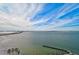 Aerial view of waterfront property with pool and lush landscaping at 888 Blvd Of The Arts # 1408, Sarasota, FL 34236