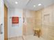 Large bathroom with walk-in shower and neutral tile at 888 Blvd Of The Arts # 1408, Sarasota, FL 34236