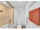 Small bathroom with shower/tub combo and neutral tile at 888 Blvd Of The Arts # 1408, Sarasota, FL 34236