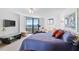 Spacious bedroom with balcony access and city views at 888 Blvd Of The Arts # 1408, Sarasota, FL 34236