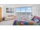 Bright bedroom with water view and comfortable seating at 888 Blvd Of The Arts # 1408, Sarasota, FL 34236