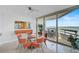 Elegant dining room with glass table and water views at 888 Blvd Of The Arts # 1408, Sarasota, FL 34236
