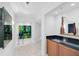 Bright entryway with unique artwork and built-in storage at 888 Blvd Of The Arts # 1408, Sarasota, FL 34236