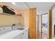 Laundry room with washer, dryer, and shelving at 888 Blvd Of The Arts # 1408, Sarasota, FL 34236