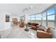 Luxury living room with stunning water views and ample seating at 888 Blvd Of The Arts # 1408, Sarasota, FL 34236