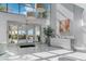 Bright lobby with water views and seating area at 888 Blvd Of The Arts # 1408, Sarasota, FL 34236