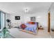 Bright bedroom with king-size bed and exercise bike at 888 Blvd Of The Arts # 1408, Sarasota, FL 34236