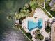 Relaxing waterfront pool with surrounding lounge chairs at 888 Blvd Of The Arts # 1408, Sarasota, FL 34236