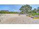Sandy play area with modern benches, ideal for relaxation and recreation at 888 Blvd Of The Arts # 1408, Sarasota, FL 34236