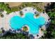 Aerial view of a large, unique-shaped community pool at 10611 Ladybug Cv, Parrish, FL 34219