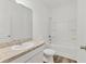 Clean bathroom with tub and shower combo at 10611 Ladybug Cv, Parrish, FL 34219