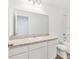 Clean bathroom, white cabinets, and a shower/tub combo at 10611 Ladybug Cv, Parrish, FL 34219