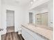 Clean bathroom with a vanity, toilet, and shower at 10611 Ladybug Cv, Parrish, FL 34219