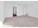 Spacious bedroom with carpet flooring and access to bathroom at 10611 Ladybug Cv, Parrish, FL 34219
