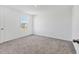 Spacious bedroom with grey carpet and a window at 10611 Ladybug Cv, Parrish, FL 34219
