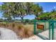 Entrance to a small dog park with rules posted at 10611 Ladybug Cv, Parrish, FL 34219