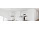 Modern kitchen with white cabinets, granite countertops, and stainless steel appliances at 10611 Ladybug Cv, Parrish, FL 34219
