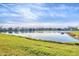 Scenic view of lake and houses at 10611 Ladybug Cv, Parrish, FL 34219