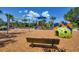 playground with swings, slides, and climbing structures at 10611 Ladybug Cv, Parrish, FL 34219