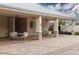 Covered patio area with tables and chairs near the pool at 10611 Ladybug Cv, Parrish, FL 34219