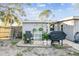 Landscaped backyard with spacious gravel area and wooden fence at 1100 27Th W Ave, Palmetto, FL 34221