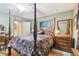 Spacious bedroom with a four-poster bed and antique furniture at 1100 27Th W Ave, Palmetto, FL 34221