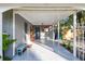 Covered carport with concrete flooring and storage at 1100 27Th W Ave, Palmetto, FL 34221