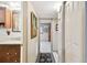 Hallway with tile flooring and access to other rooms at 1100 27Th W Ave, Palmetto, FL 34221